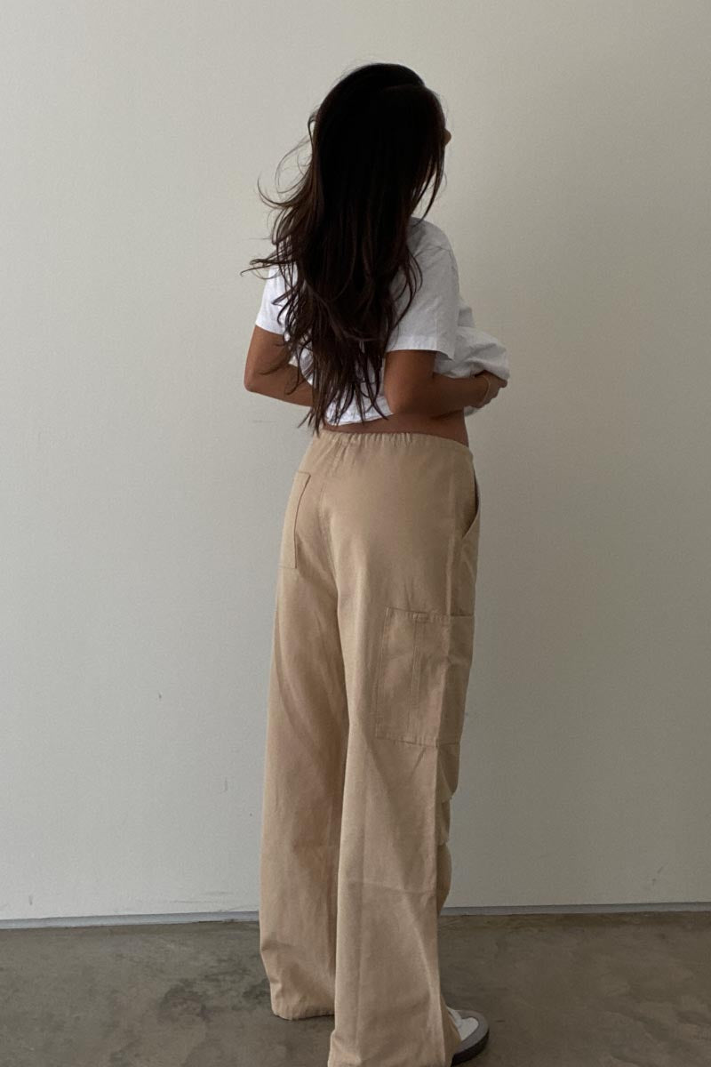 Girl wearing ladies khaki cargo pants and white t-shirt