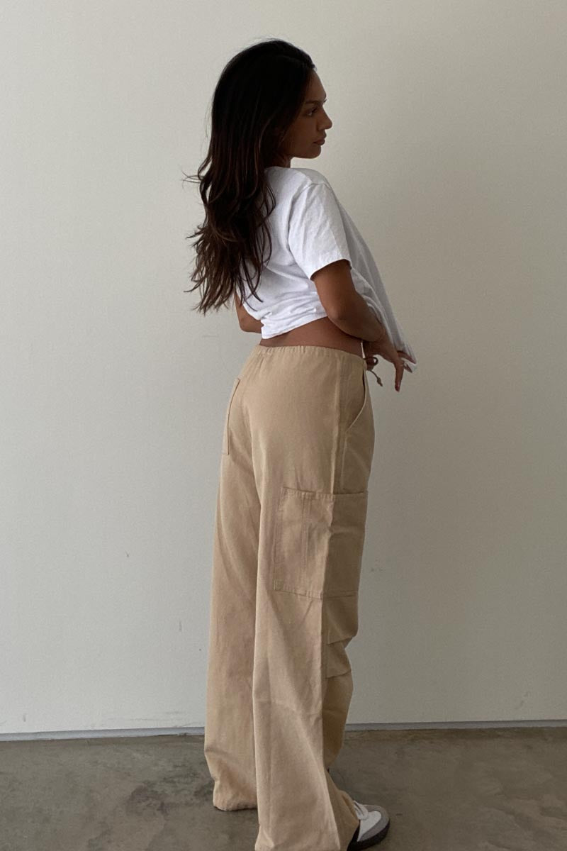 Girl wearing ladies khaki cargo pants and white t-shirt