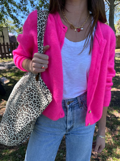 Girl wearing bright pink American Vintage Clothing Vitow Cardi holding Garance Paris Leopard Print Tote Bag and trendy charm necklace