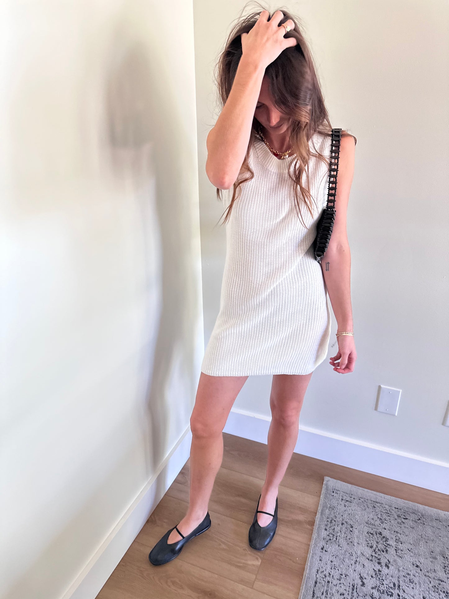 Girl wearing white knit mini dress for women