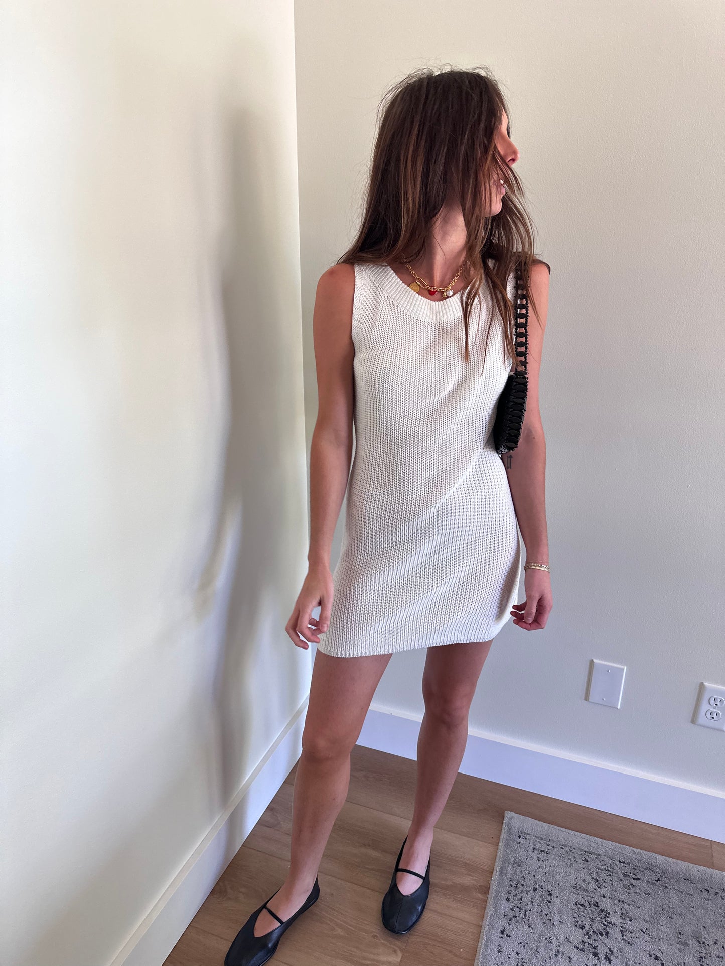 Girl wearing white knit mini dress for women