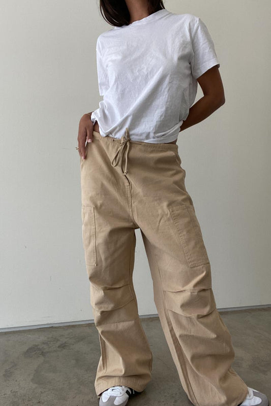 Girl wearing ladies khaki cargo pants and white t-shirt